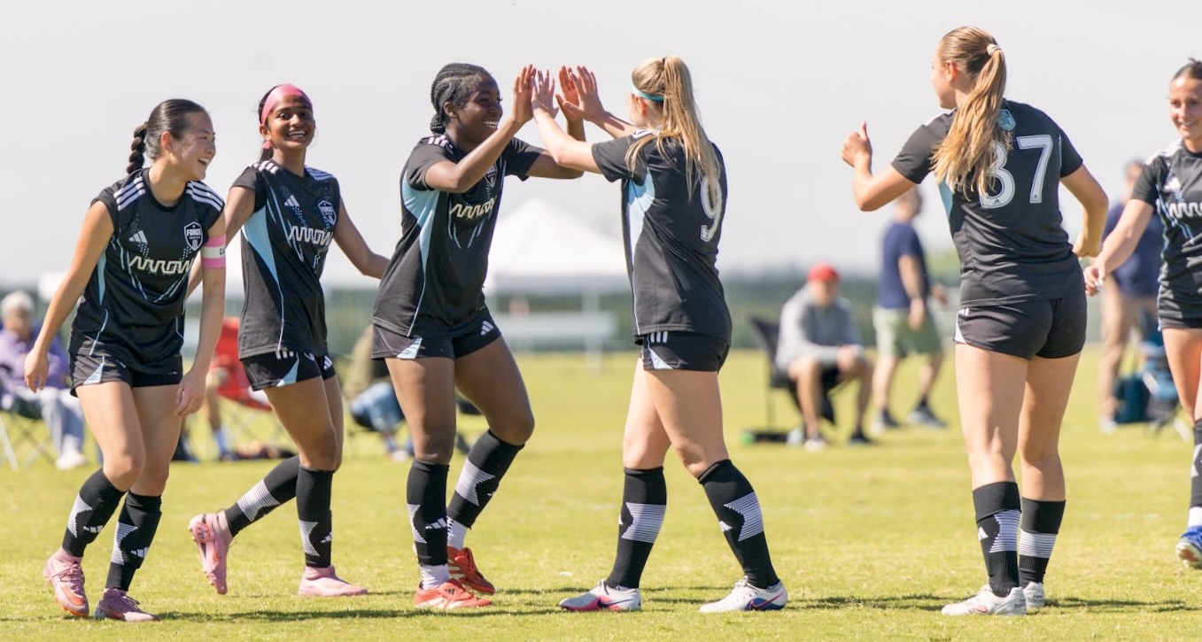 De Anza Force teammates high-fiving in celebration