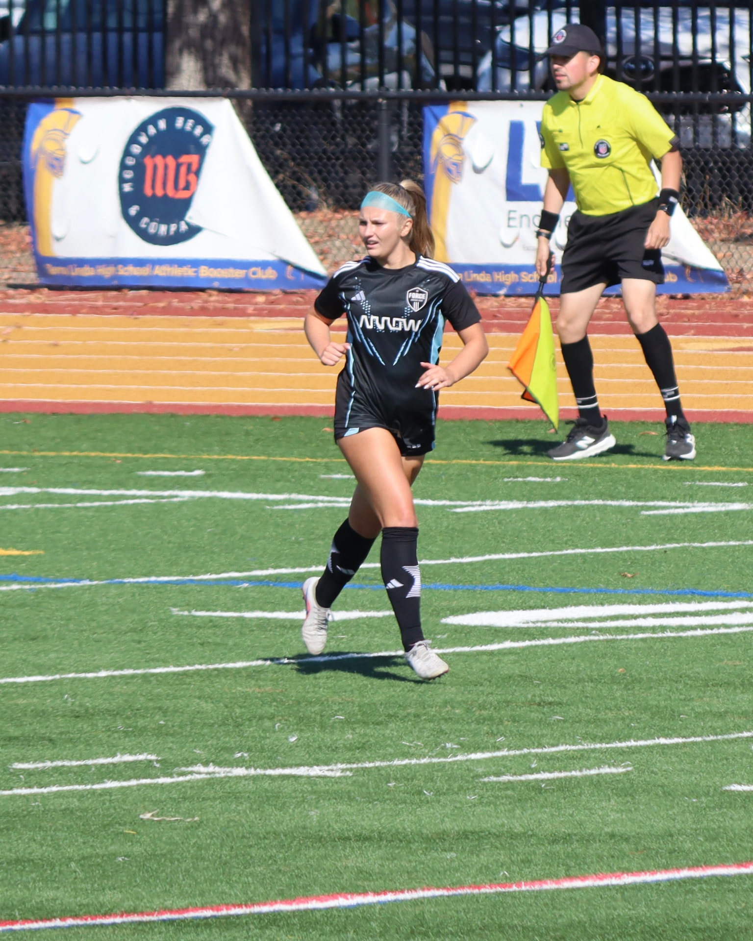 Everleigh Porter #9 running on the field at an ECNL match