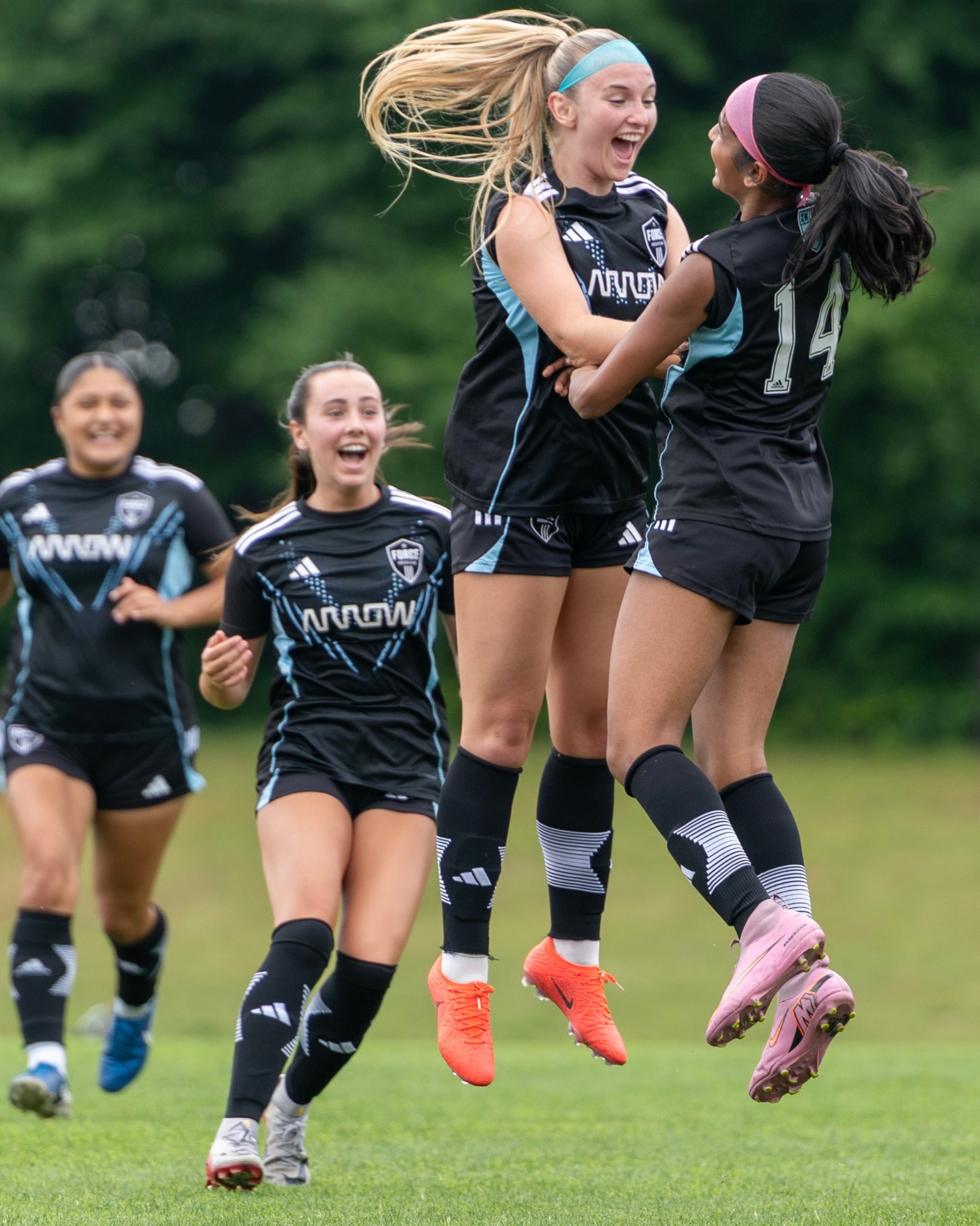 Everleigh Porter celebrating a goal with teammates