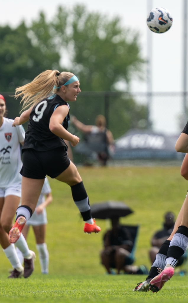 Everleigh Porter jumping to win a header during a match